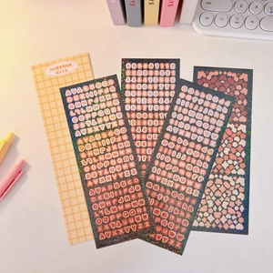 Detailed view of laser glitter stickers with letters and numbers for DIY journals