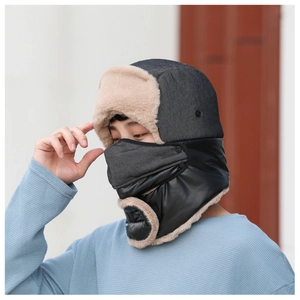 Detail view of winter trapper hat with warm faux fur lining and integrated face mask