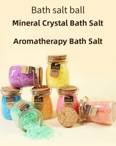 Detailed view of colorful mineral bath salts in glass jars with vintage love tags