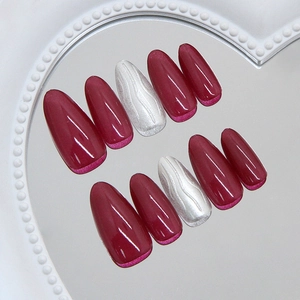 Almond press on nails in burgundy and silver 3D wave pattern with heart pearl tray
