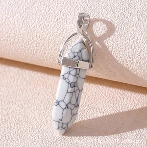 Macro detail of white howlite hexagonal stone pendant with natural marble texture