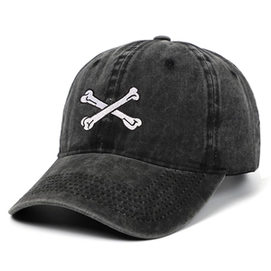 Vintage washed cotton baseball cap with white crossbones embroidery in charcoal grey