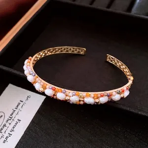 18K gold plated vintage open bangle with pearls and amethyst on black velvet
