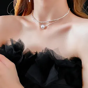 Collier double couche avec perle blanche et chaîne en argent pour femme
