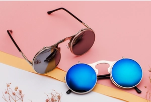Steampunk flip-up sunglasses with silver metal frames and blue reflective round lenses