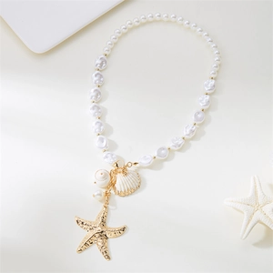Close-up of ocean-themed necklace with starfish, seashell pendants and faux pearls