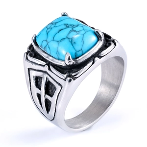 Detailed macro view of retro stainless steel ring with square turquoise and floral pattern
