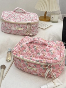 Quilted pink floral makeup bag set for travel storage with portable handle and zipper