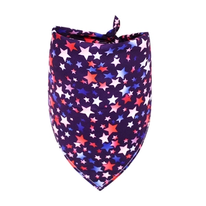 Close-up of patriotic pet bandana with red, white, and blue star patterns on navy blue fabric