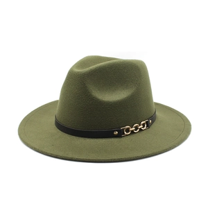 Detail of dark green wide brim fedora hat with black leather strap and gold chain buckle