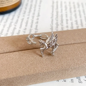 Detailed macro view of silver Pegasus adjustable ring with intricate wing textures