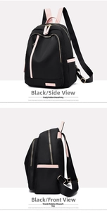 Side view of multi-pocket black nylon backpack with pink leather trim and metal logo