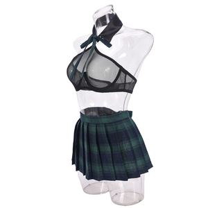 Macro view of sheer mesh halter top with bow and plaid pleated skirt uniform