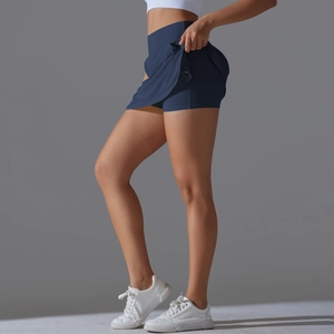 High-waisted navy blue tennis skort with built-in shorts and quick-dry athletic fabric
