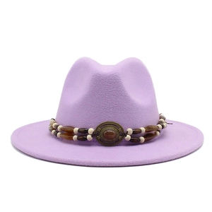Detail of lavender wool felt fedora with bohemian beaded band and vintage metal ornament