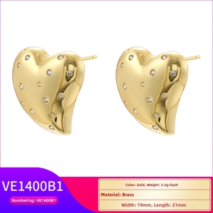 Detailed size view of gold brass heart earrings with zircon inlay, 19mm by 21mm