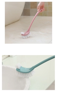 Pink and green toilet brushes with long handles for bathroom floor and sink cleaning