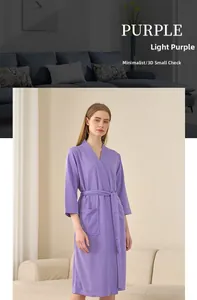 Detailed view of light purple waffle knit bathrobe with belted waist and side pocket