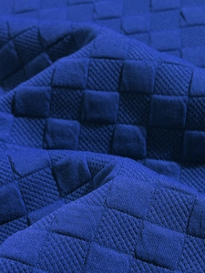 Detailed view of dark blue long-sleeve shirt showing 3D square quilted texture