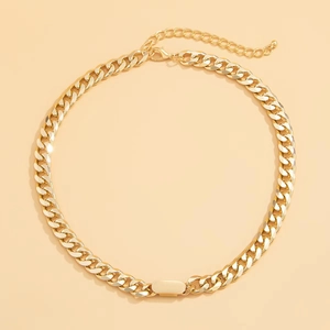 Detail of gold Cuban link chain necklace with smooth rectangular metal plate and lobster clasp
