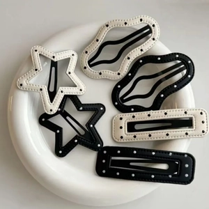Set of 6 minimalist black and white leather hair clips in star, wave, and rectangle shapes