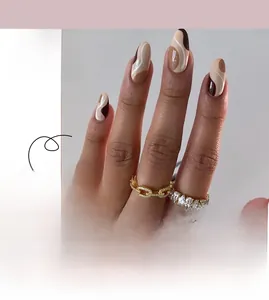 Close-up of vintage brown and beige almond press-on nails with abstract streamline design