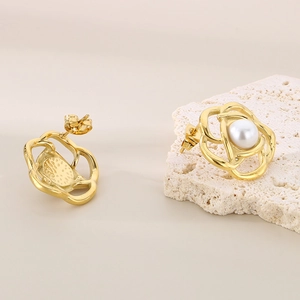 Elegant gold camellia flower pearl stud earrings with a hollow rotating petal design