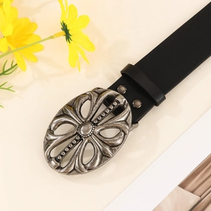 Punk style black leather belt with antique silver oval hollow buckle on a beige background