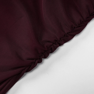 Detail of burgundy mesh dress showing ruffled edges and precise stitching texture