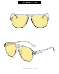 Detail view of C01 aviator sunglasses with transparent grey frames and yellow lenses