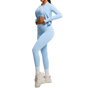 Three-piece light blue yoga set with high waist leggings and zip-up jacket