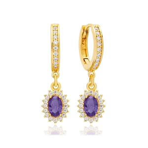 Detailed macro of gold plated hoop earring with purple oval zircon and crystal halo
