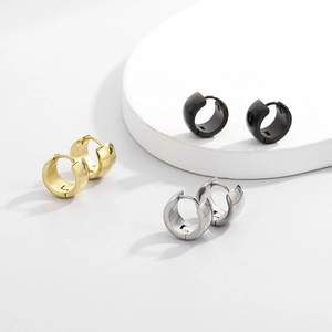 Detail shot of 7mm minimalist titanium steel hoop earrings in gold, black, and silver