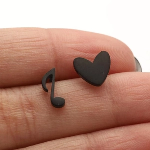 Asymmetric matte black stainless steel stud earrings featuring music note and heart shapes