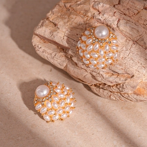 Vintage gold clustered pearl and rhinestone geometric stud earrings in a classic palace style