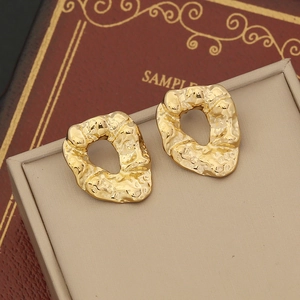Minimalist gold irregular hammered earrings in an abstract oval shape for women