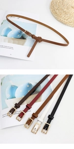 Flat lay of thin leather belts in five colors with golden buckles for women