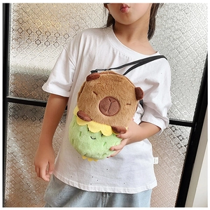 Adorable capybara plush crossbody bag shown on child model in soft indoor lighting
