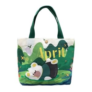 Cartoon bear canvas handbag for women with yellow April text on a clean white background