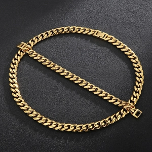 Detailed view of a thick golden Cuban link chain with a square clasp on dark surface