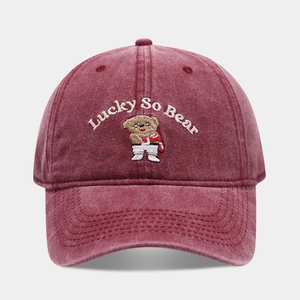 Detailed bear embroidery and Lucky So Bear text on washed burgundy cotton baseball cap