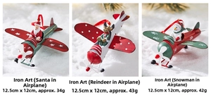 Close-up of metal Santa, Reindeer and Snowman aircraft ornaments for Christmas trees