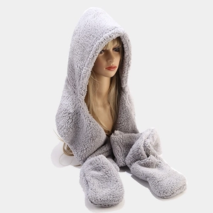 Close-up of gray plush 3-in-1 hat scarf and gloves set on a mannequin head