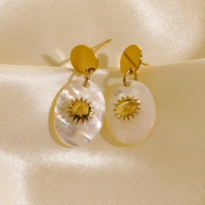 Elegant French style gold plated earrings with white oval shell and sunburst pattern