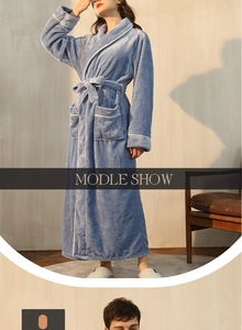 Macro detail of thick light blue flannel bathrobe showing soft texture and white piping trim