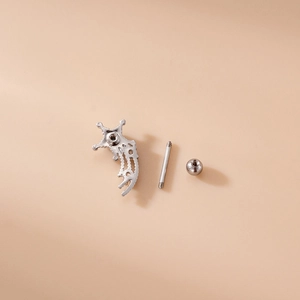 Disassembled view of silver stainless steel star cartilage stud with screw-back components
