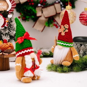 Detailed view of Christmas plush gnomes with candy cane and rolling pin festive decor