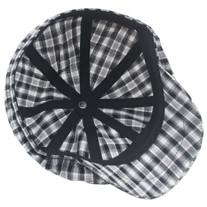 Detailed interior view of plaid cotton beret featuring black reinforced ribbon and metal buckle