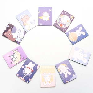 Mini creative pocket notebooks with cute cartoon patterns arranged in a circle on white back