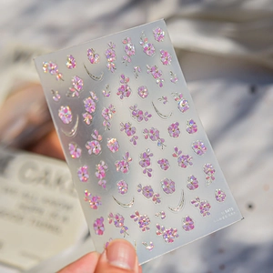 Macro detail of TO 5475 nail art stickers with pink roses and golden crescent moons